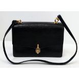 A Vintage Gucci Brown Leather Hand/Shoulder Bag. Gold-tone hardware. Leather interior with two