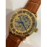 Genuine STUHRLING of NEW YORK AUTOMATIC SKELETON WATCH. Blue hands model finished in gold plated