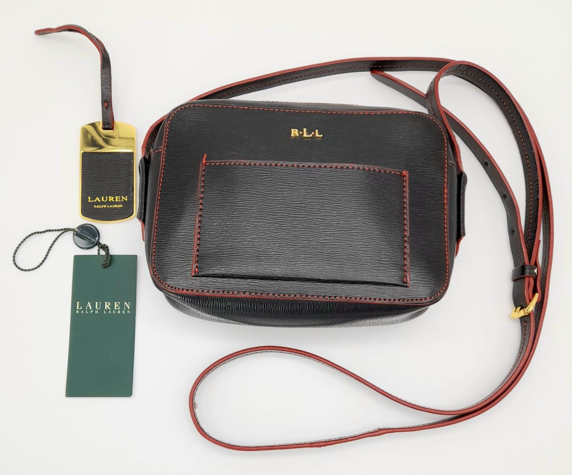 A Ralph Lauren Small Crossbody Leather Bag/Pouch. Gold-tone tag. Adjustable strap. 18cm x 14cm. In