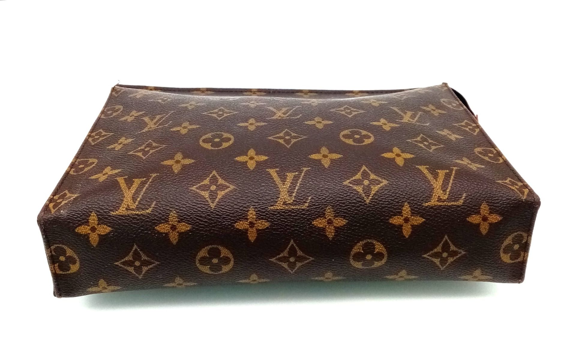 A Louis Vuitton Monogram Canvas Pouch. 25cm x 20cm. In good condition but please see photos. Ref: - Image 4 of 6