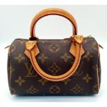 A Louis Vuitton Miniature Monogram Canvas Bag. 16cm x 11cm. Ref: 13117