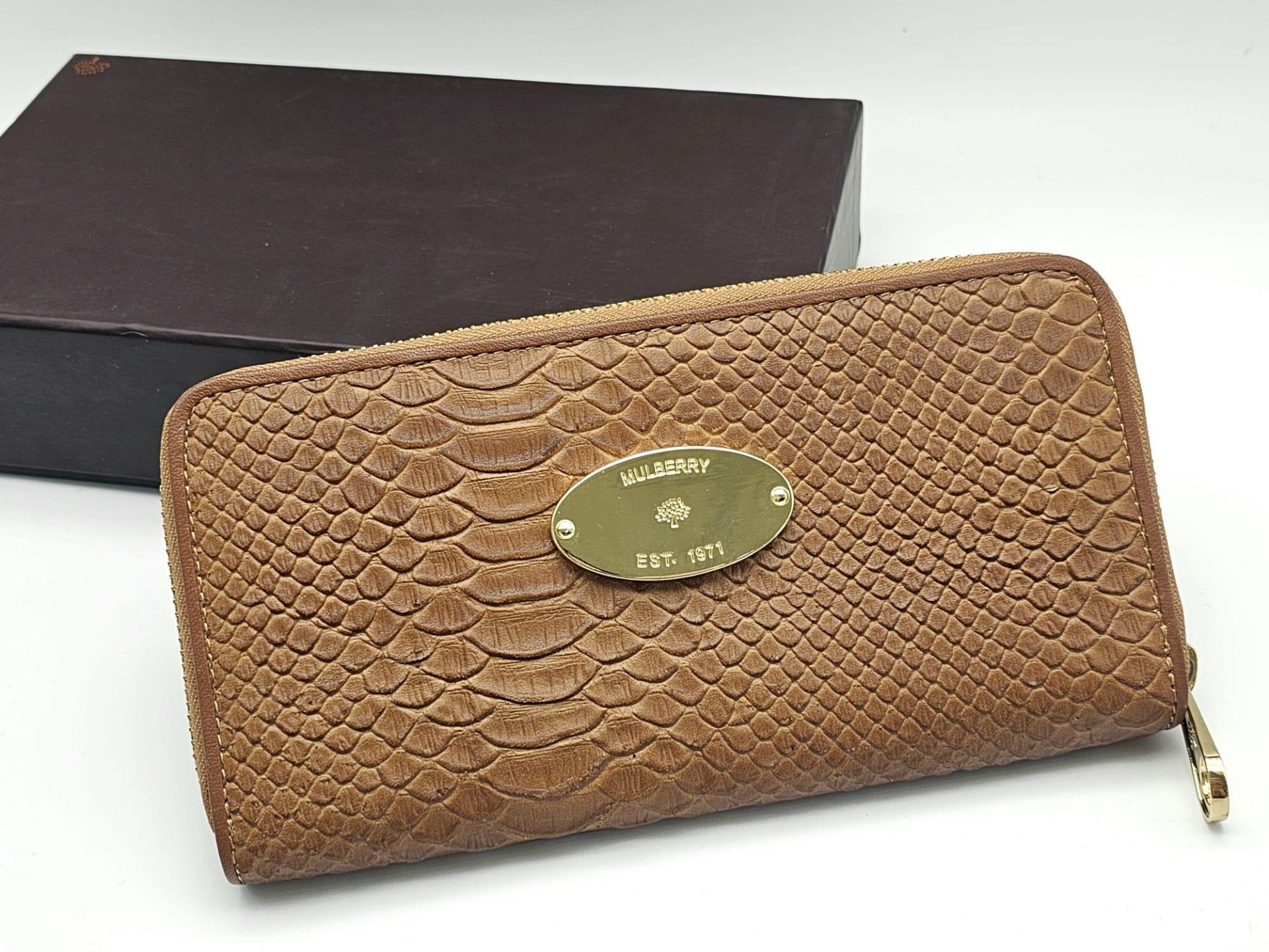 A Mulberry Brown Leather Clutch Bag/Wallet. Textured leather exterior with an inner zipped