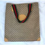 A Gucci Monogram Small Canvas Tote Bag. Monogram exterior with leather trim and red and green