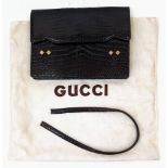 A Gucci Brown Reptilian Skin Leather Handbag with Dust Cover. Note - It has a completely broken