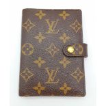 A Louis Vuitton Monogram Canvas Diary Holder. 14cm x 10cm. Please see photos for conditions. Ref: