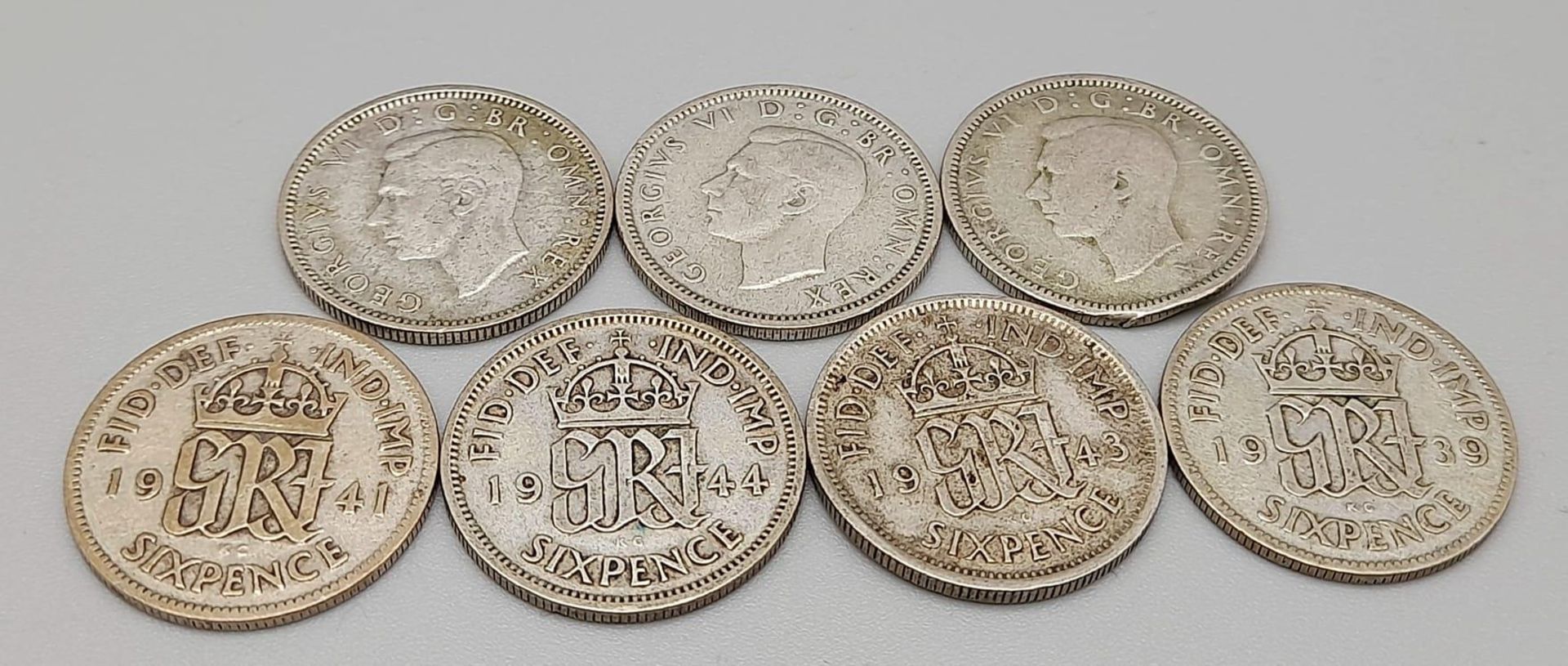 A Rare Full Set of 7 Fine Condition WW2 Silver Six Penny Coins 1939-1945. Inclusive (500 silver