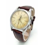 A Very Rare (1950s) Tudor Advisor Alarm Gents Watch. Brown leather strap. Steel case - 34mm. Gilt