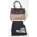 A Moschino Love Crossbody Bag. Cloth exterior with brown leather trim and handles. Gold-tone