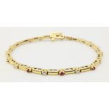 14k yellow gold diamond and ruby line bracelet (dia:0.27ct/ruby:0.50ct) 7.5" length, 10.7g