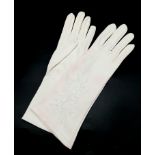 A PAIR OF 1950'S EMBROIDERED EVENING GLOVES WITH TRACES OF MAKE-UP STILL ON THEM a/f
