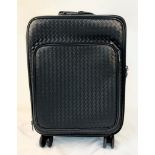 A Bottega Veneta Black Intrecciato Leather Trolley Case. Large exterior pocket. Generous, deep