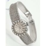 A JAEGER LE COULTRE LADIES 18K WHITE GOLD AND DIAMOND MANUAL WATCH. 18mm