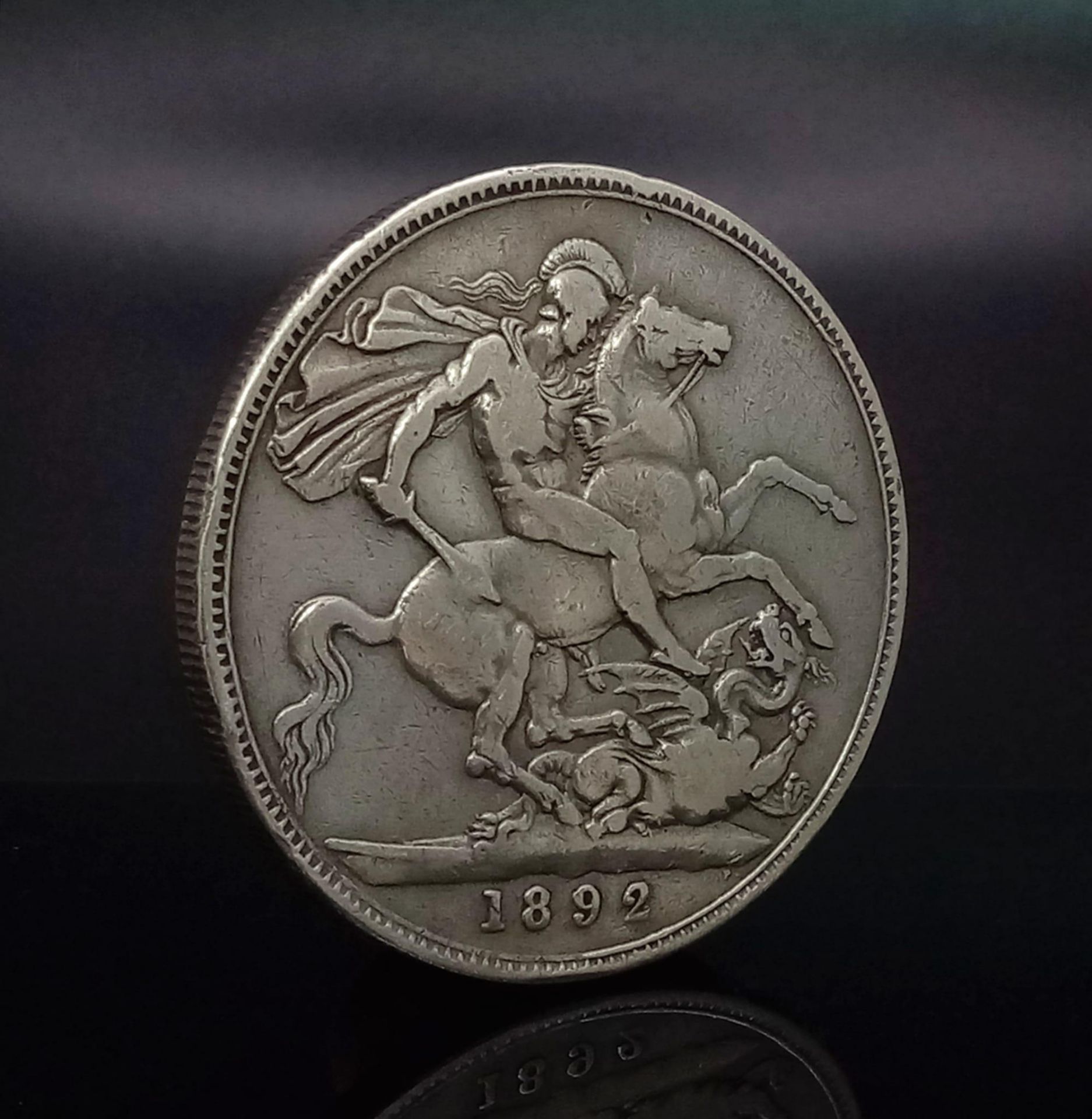 An 1892 Queen Victoria Silver Crown Coin. Please see photos for conditions.