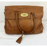 A Mulberry Classic Brown Leather Handbag. Textured brown leather. Gold-tone hardware. Spacious