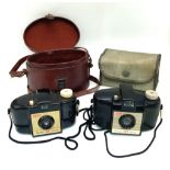 Two Vintage Kodak Brownie 127 Cameras. Both with cases.