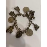 Vintage SILVER CHARM BRACELET , Charms to include ballet shoes, piggy, Bible, piano, church,and