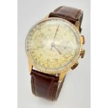 A Vintage Breitling Chronomat 18K Gold Gents Watch. Brown leather strap. 18k Gold case - 36mm.