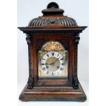 An Antique German Junghans Mantel Clock. Good condition oak wooden case and dial with gilded