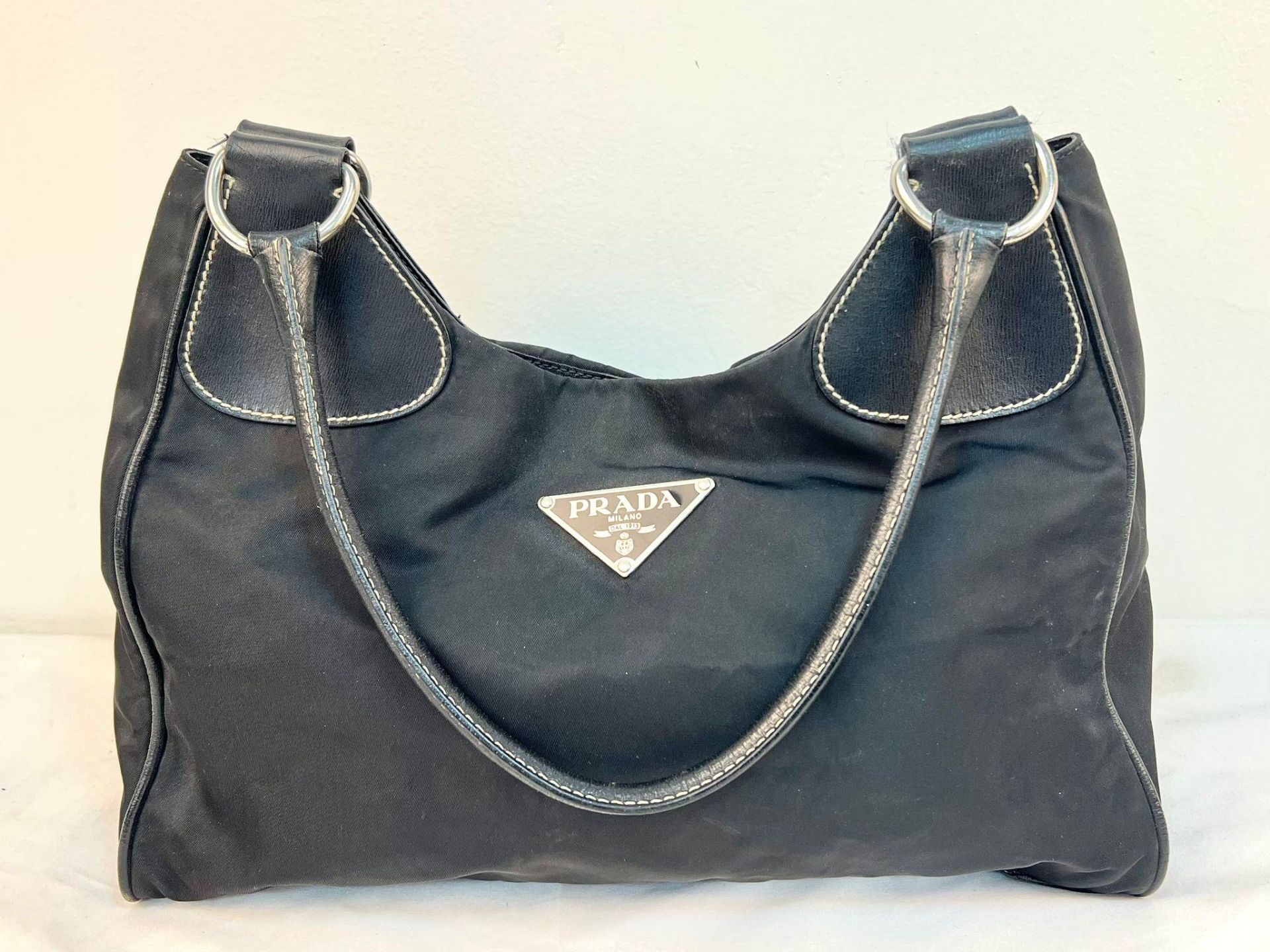 A Prada Black Cloth Bag with Black Leather Trim and Handle. 30cm x 25cm. Zipped inner compartment.