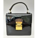 A Louis Vuitton Spring Street Patent Monogram Brown Leather Handbag. Adjustable shoulder strap. Gold
