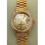 A LADIES 18K GOLD ROLEX PERPETUAL DATEJUST WITH DIAMOND NUMERALS , ATTRACTIVE GOLDTONE DIAL AND