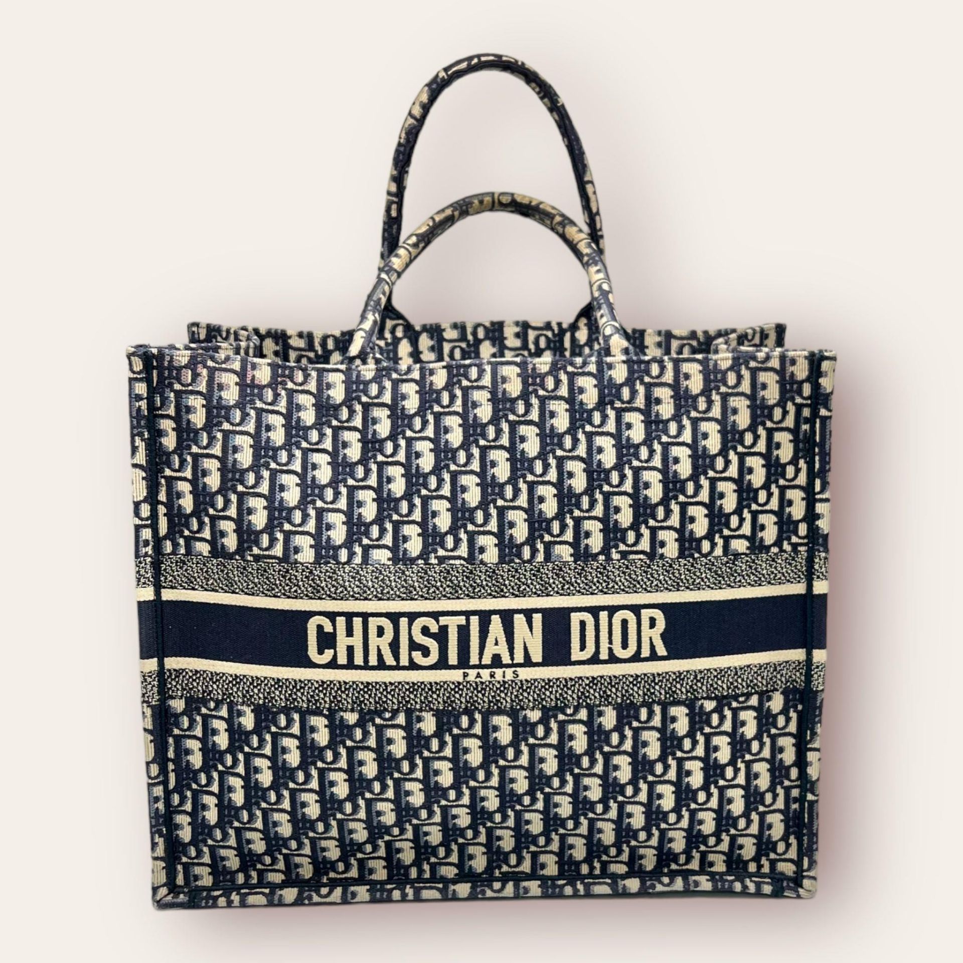 A Christian Dior Grey Oblique Book Tote Bag. Embroidered exterior, spacious interior. Ref: 13139.