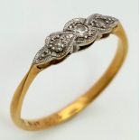 An 18 K yellow gold and platinum ring with a trilogy of diamonds. Ring size: N, weight: 1.7 g.