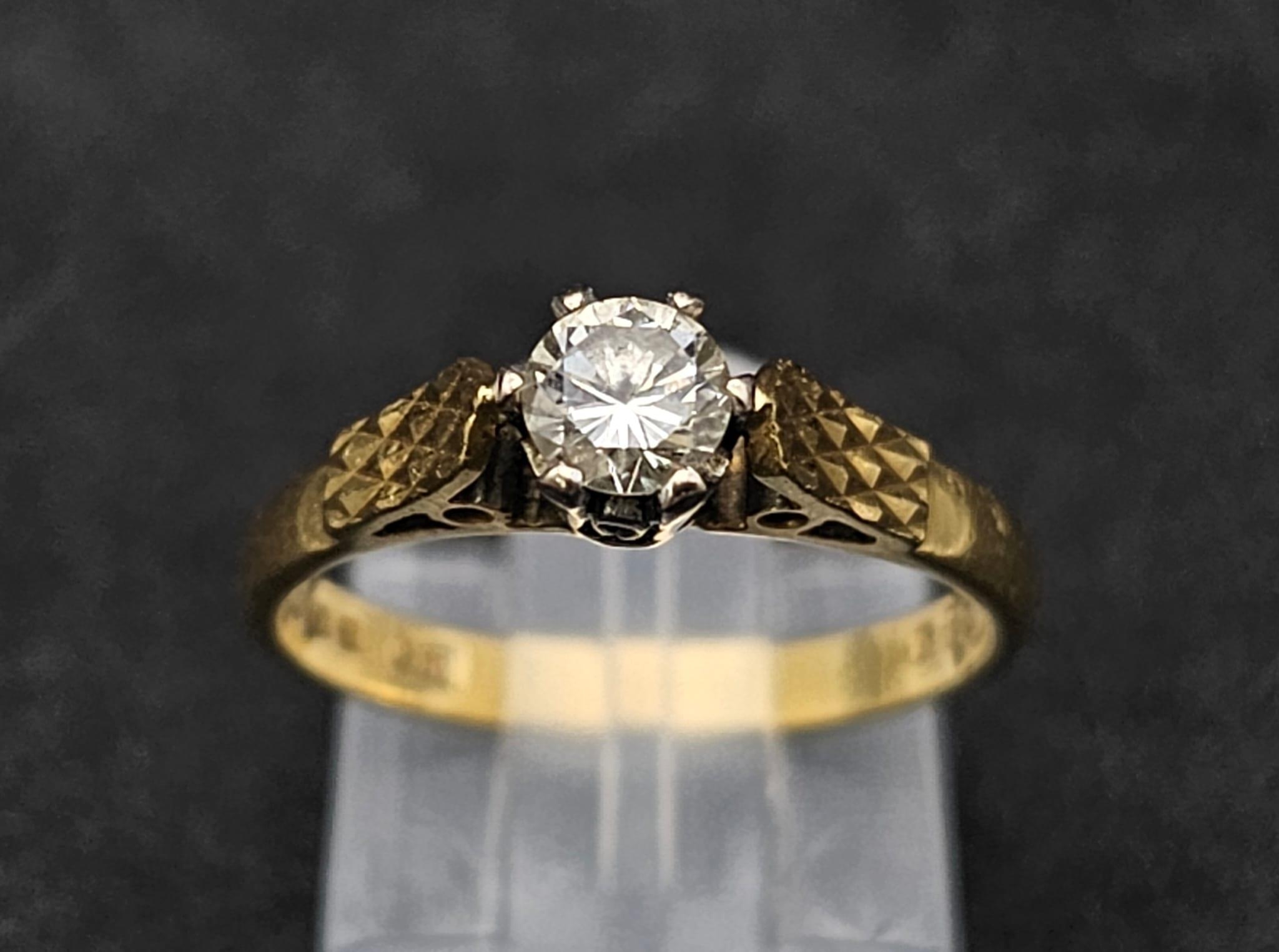 An 18K Yellow Gold Diamond Solitaire Ring. 0.35ct. Size L. 2.96g total weight.