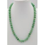 An Emerald Bead Necklace with gilded spacers and clasp. 44cm