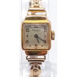 A vintage, 18 K yellow gold RELUXO ladies watch with a stainless steel and rolled gold bracelet.