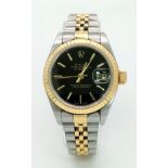 A LADIES BI-METAL ROLEX OYSTER PERPETUAL DATEJUST WITH BLACK DIAL AND DATEBOX . 26mm