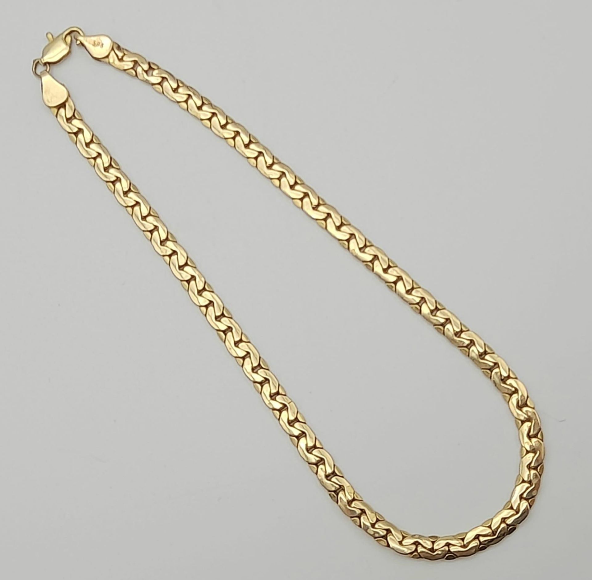 A 14K Yellow Gold Flat Tight-Curb-Link Long Bracelet. 27cm. 5.93g - Bild 2 aus 4
