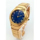 A STUNNING CARTIER 18K GOLD WRISTWATCH WITH MESMERISING BLUE DIAL AND PATTERNED 18K GOLD STRAP ,