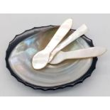 A vintage Mother of Pearl wasabi dish with three spoons.