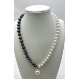 A Black and White Freshwater Pearl Shell Necklace and White Shell Pendant. 8mm and 14mm. 44cm