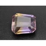 A 10.65ct Bolivia Bi-Color Purple and Orange Loose Gemstone. GFCO Swiss Certified.