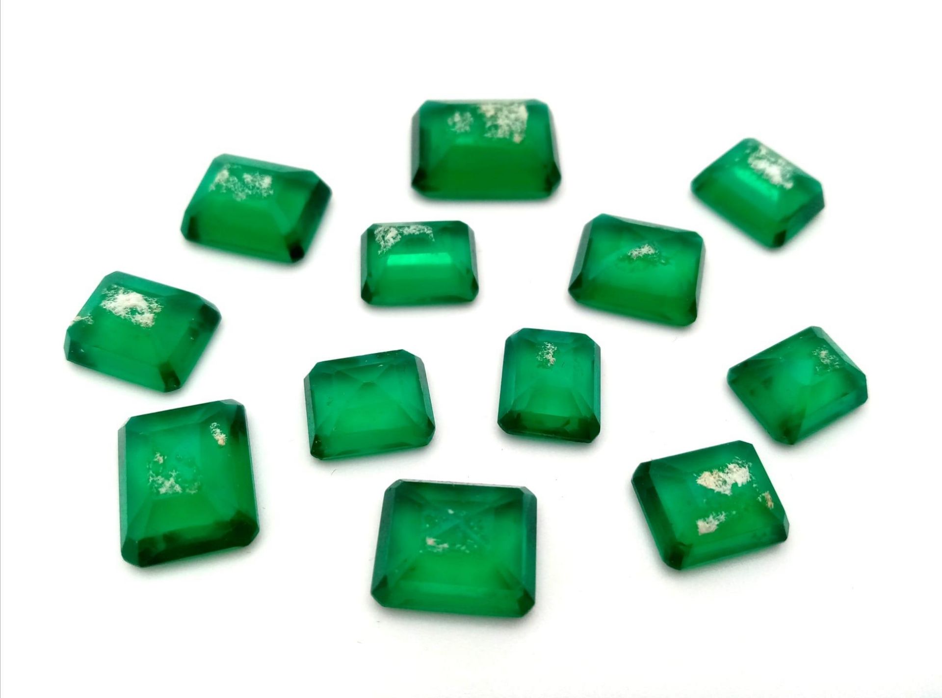 A 101.30ct of Natural Faceted Green Onyx Lot, include 12 Pcs. In Rectangular Shapes and comes with a