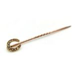 An Antique Victorian 15K Gold and Horseshoe Pearl Stickpin. 5cm.