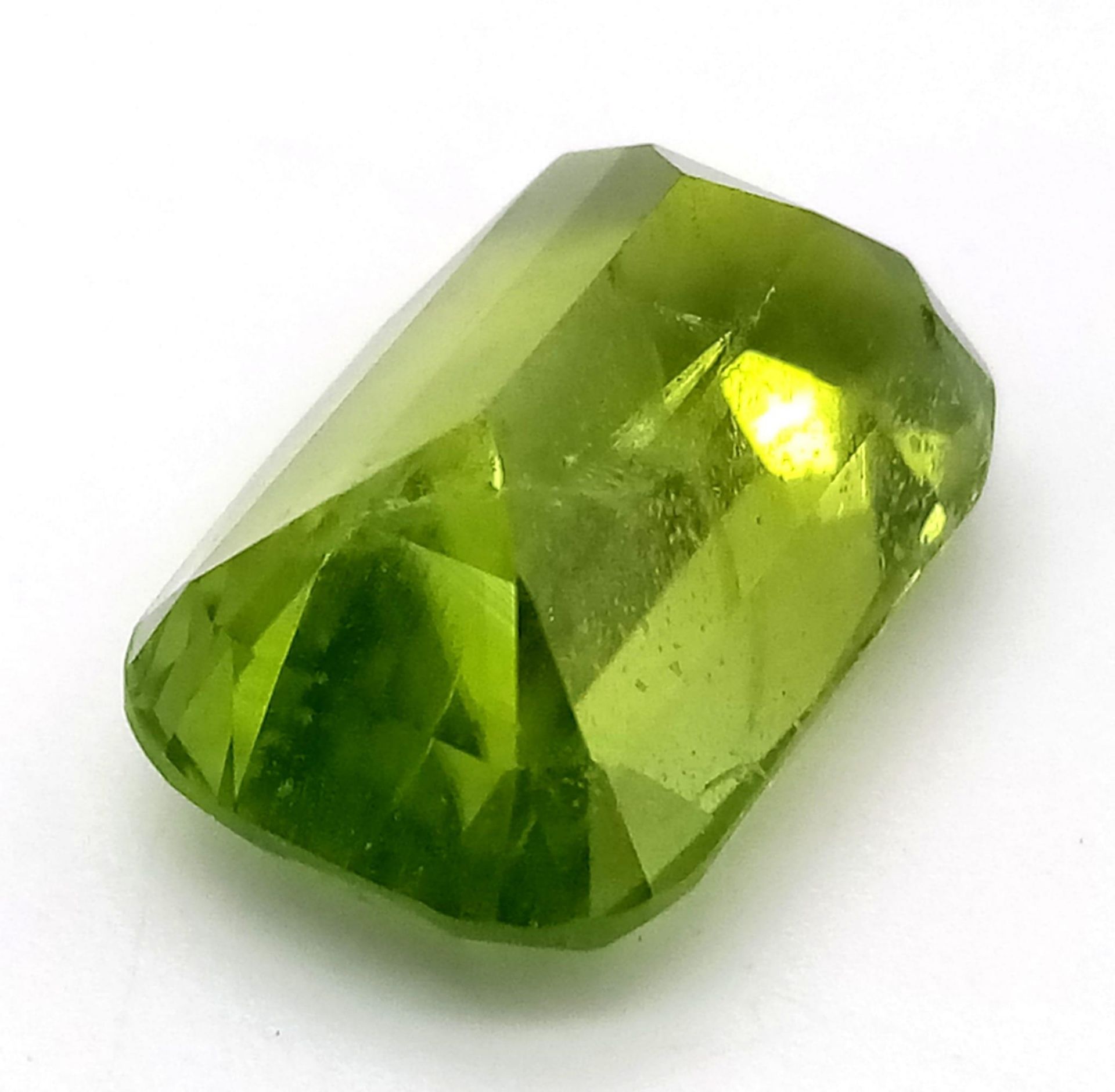 A Rare 9.97ct Pakistani Peridot. Cushion cut with no inclusions. Comes with a GFCO Swiss - Image 3 of 5