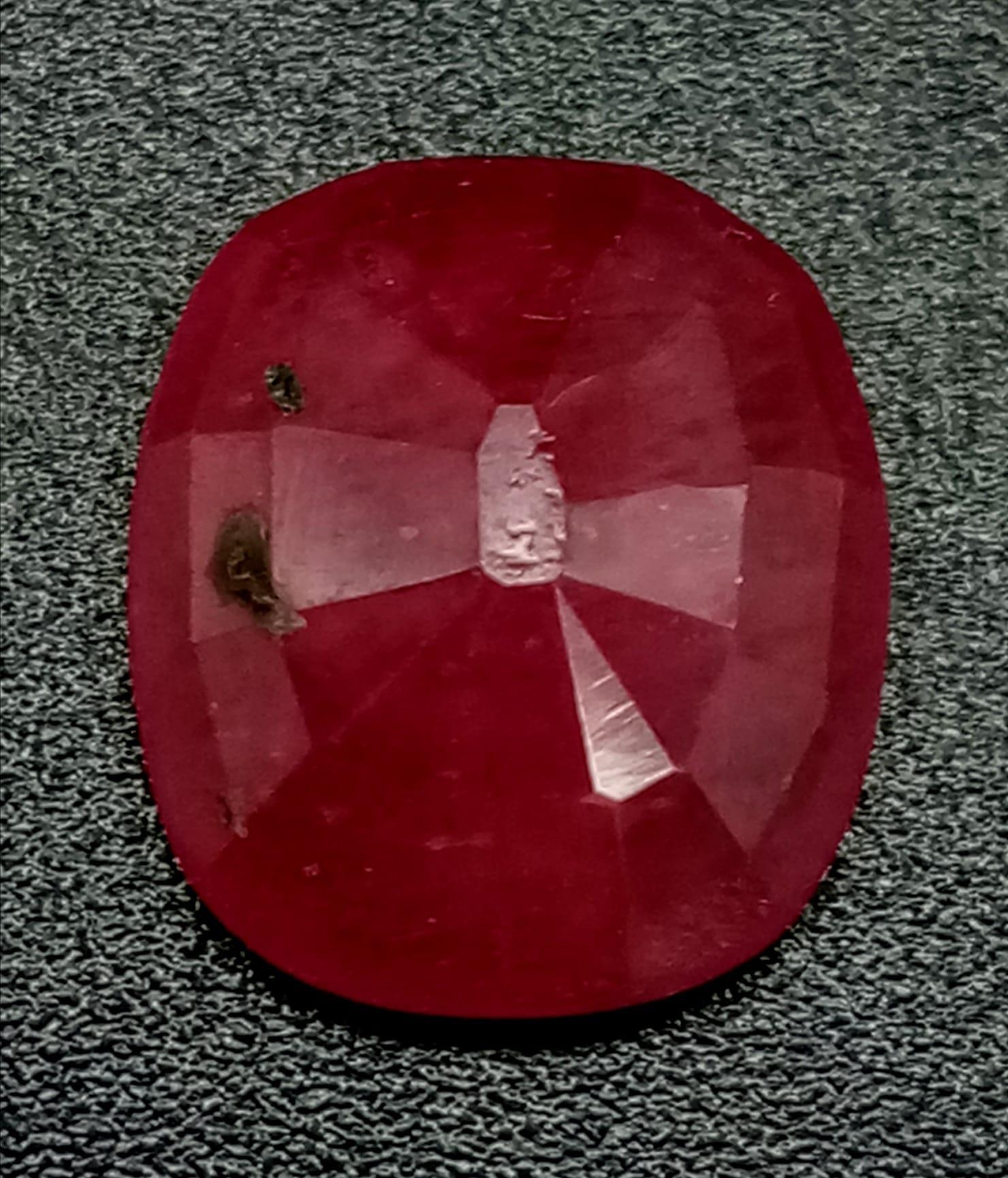A Rare 6.13ct Natural Ruby from Mozambique. Heat treated and comes with a GGI certificate. - Image 3 of 4