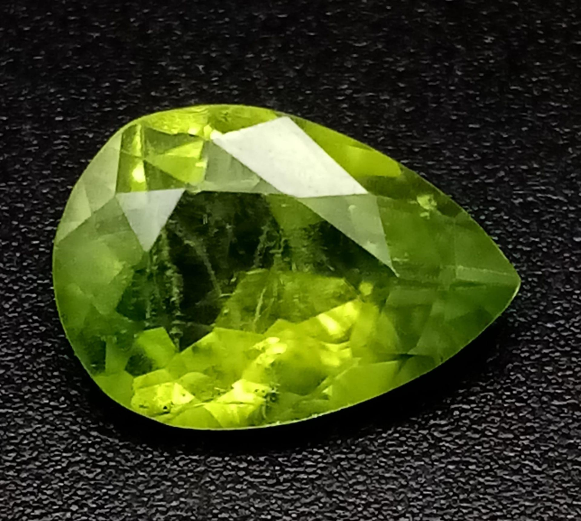 A 2.53ct Pakistani Peridot Gemstone. Pear shaped and comes with a GFCO Swiss Certificate.