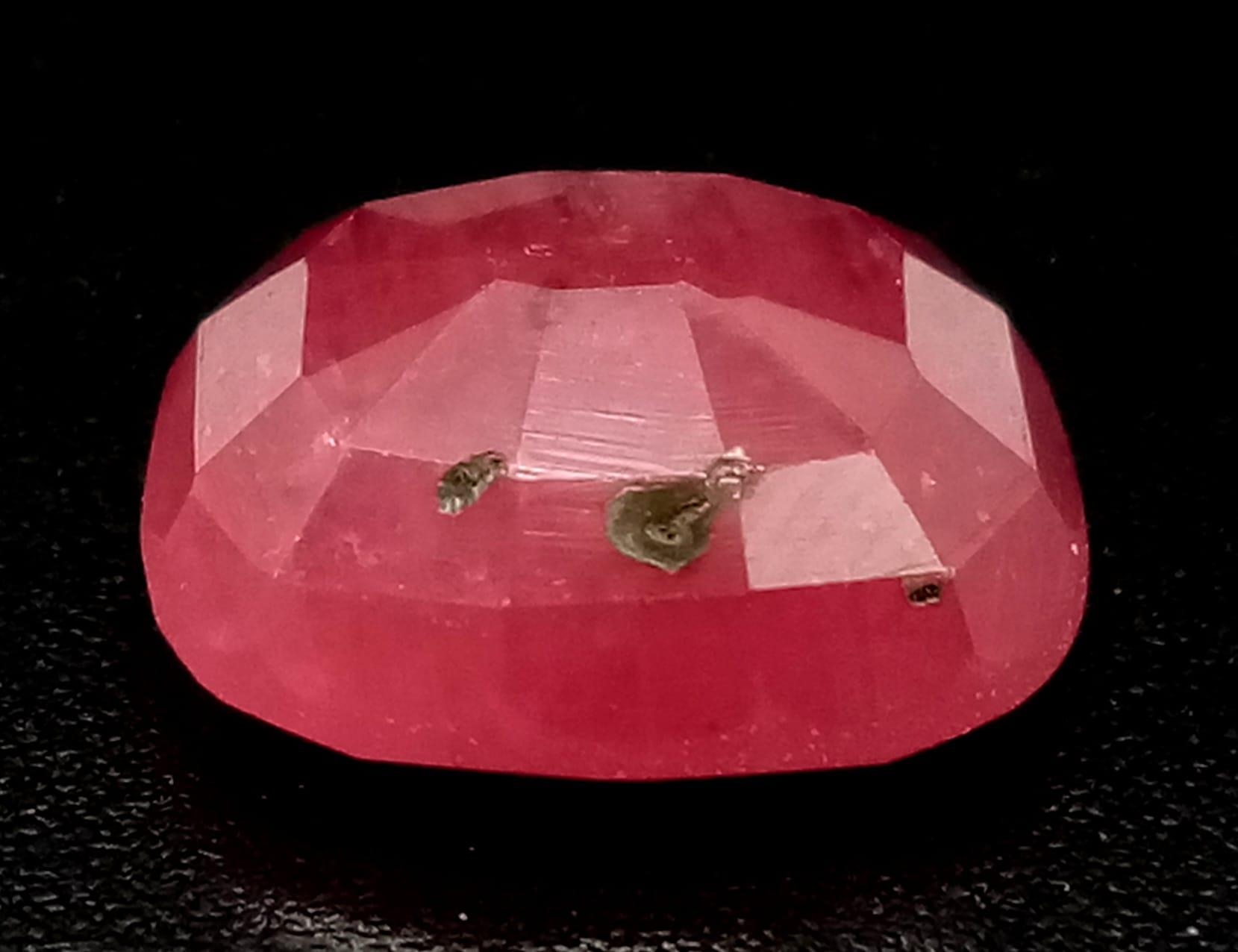 A Rare 6.13ct Natural Ruby from Mozambique. Heat treated and comes with a GGI certificate. - Image 2 of 4