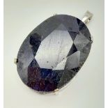 A Blue Oval-Cut Sapphire Pendant set in 925 Sterling silver. 430ct Sapphire! 95g total weight. 5cm