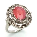A 925 Silver Ruby Ring with a Halo of Diamond Accents. Total Weight 7.46g. Size M.