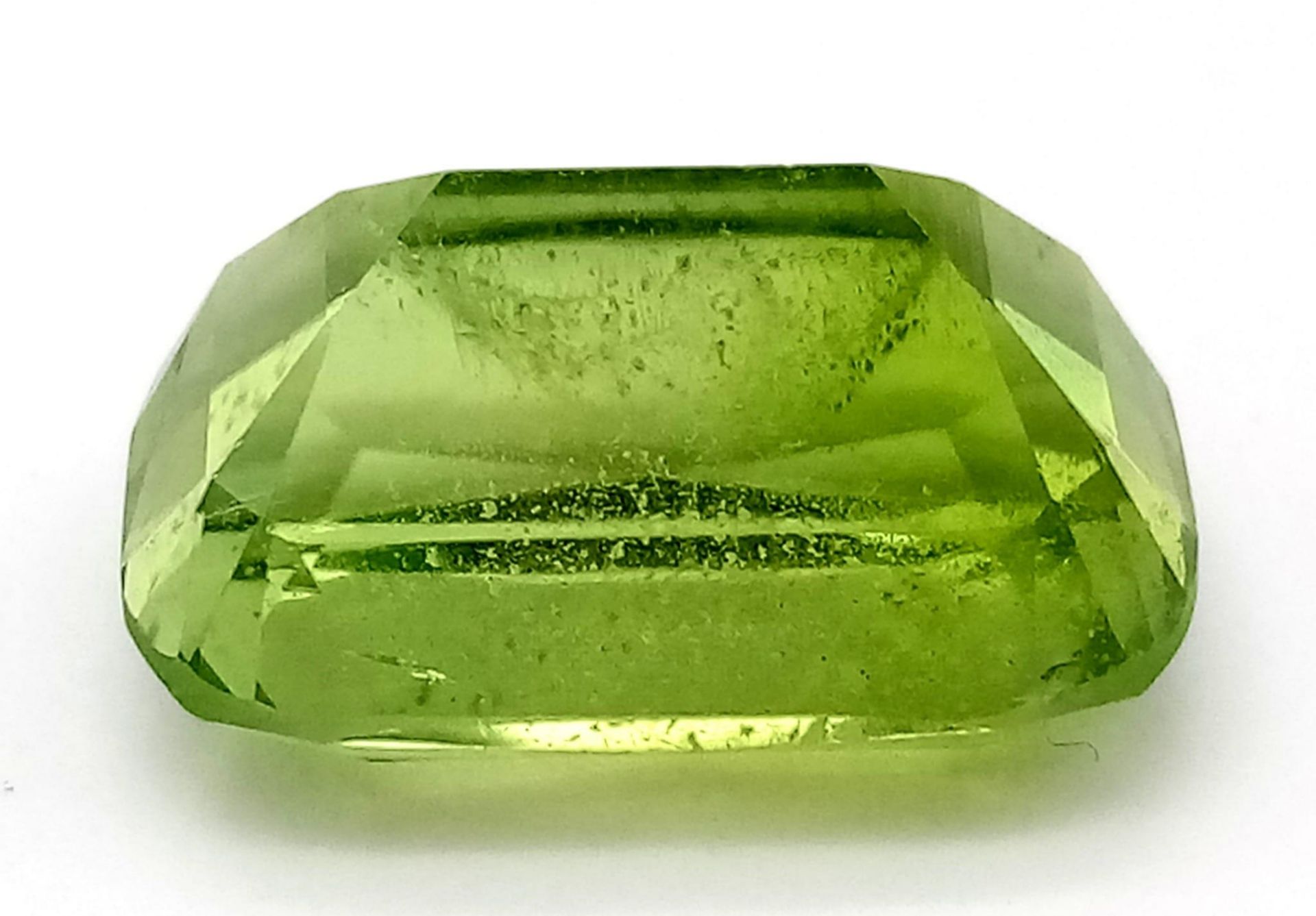 A Rare 9.97ct Pakistani Peridot. Cushion cut with no inclusions. Comes with a GFCO Swiss - Image 2 of 5