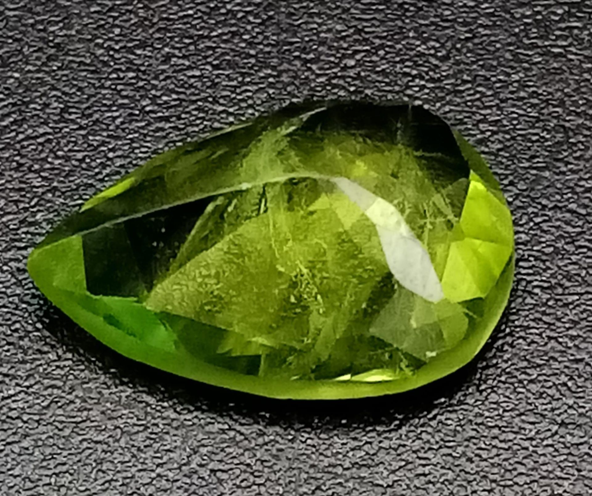 A 2.53ct Pakistani Peridot Gemstone. Pear shaped and comes with a GFCO Swiss Certificate. - Image 2 of 4