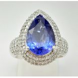 18k White Gold and Pear Cut 4.65ct Tanzanite Ring, with 227 Round Brilliant Cut Natural Diamonds.