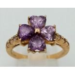 A flower Shaped Amethyst Ring. Size: N . Total weight: 5g