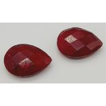 A Pair of 13.25ct of Faceted Natural Ruby, in Pear Shapes. Comes with a GLI Certificate.