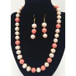 A beautiful necklace and earrings set consisting of large, natural cultured pearls (12 mm) and